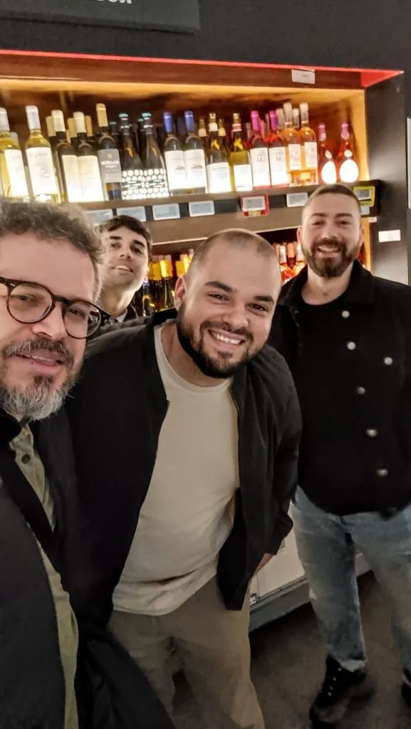 The four members of the STILLROOM expedition, pictured together in front of the wine displays at the Makro store at Paseo Imperial