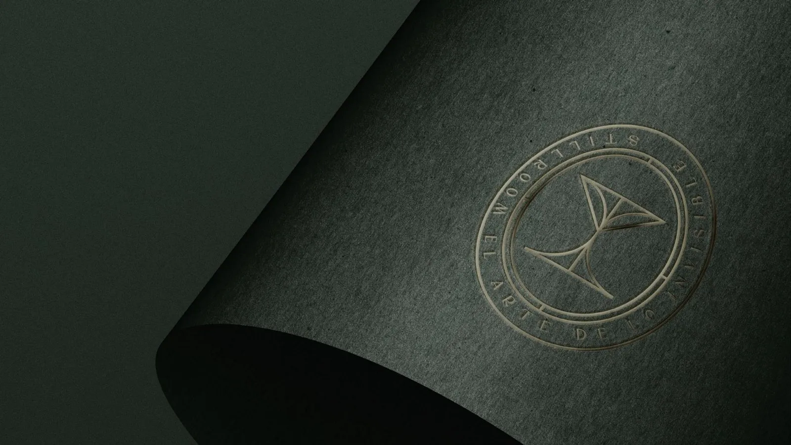 Circular STILLROOM seal embossed on dark green paper with the claim “The Art of the Invisible”